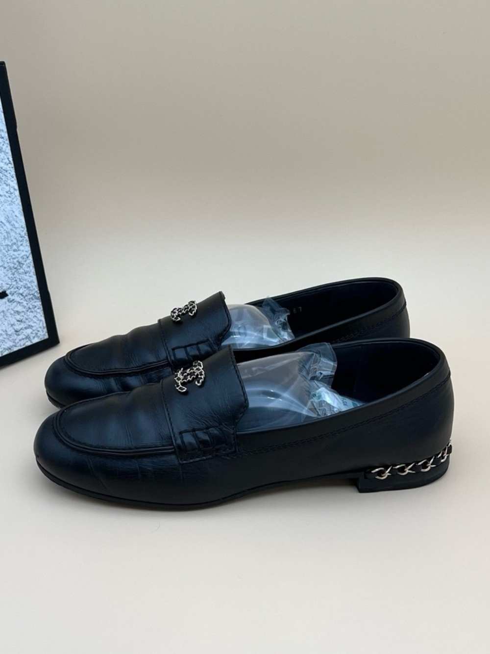 CHANEL Black Leather Chain-Trim Loafers